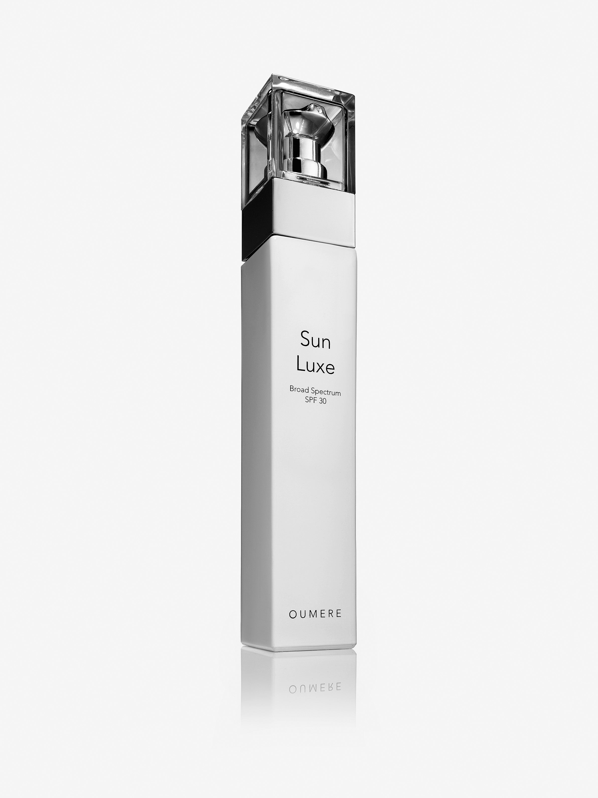 Glass bottle of Sun Luxe Mineral Daily Sunscreen - O U M E R E