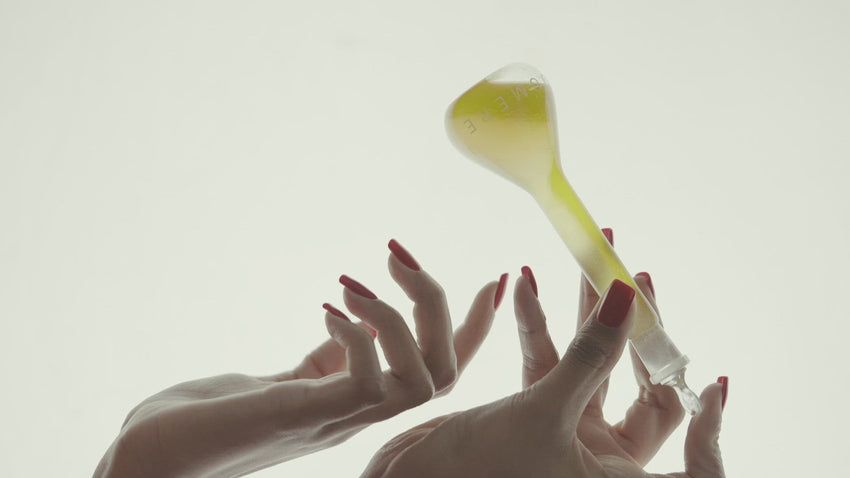 Video of hand model shaking bottle of Serum Bioluminelle to mix the oil and water layers 